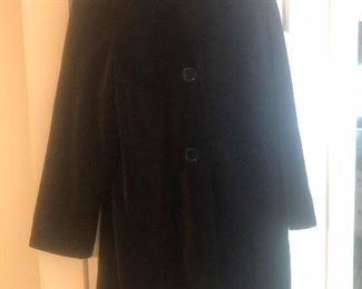This is a vintage black velvet swing coat and it is AWESOME