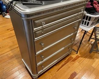 Silver leaf look chest of draerss with mirrored trim