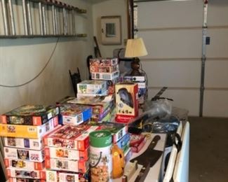 Puzzles and assorted tools and ladder