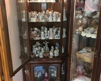 Corner curio cabinet with lights and filled with Precious Moments and other collectibles! Cabinet SOLD!
