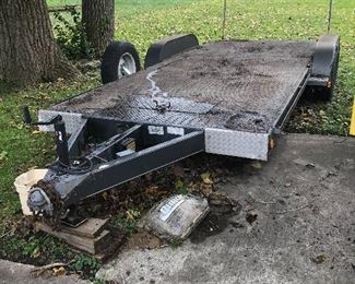 Nice shape twin axle trailer. Self storing ramps and recent tires! 16.5 in length