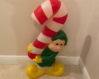 $50 - That candy cane is far to big for him to carry.  That is obviously a two team member lift.  I'm calling OSHA.