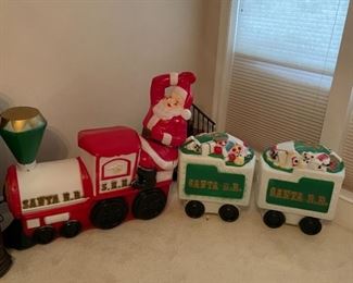 This Santa looks like he's having way too much fun on one of those mini trains they used to have in shopping malls.  Each piece is priced separate Train is $395 (There are a few cracks but no missing chunks) one car is $85 and one is $60 (it has some issues as well)