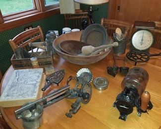 Antique kitchen items, coffee grinder, apple peeler, wooden bowl, trivets and more