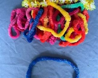 Approximately 22 plastic leis.