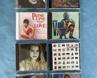Eight country CDs featuring Rosanne Cash, Patsy Cline, Kenny Rogers, and Reba