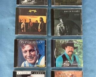 Eight country CDs featuring Alabama, Garth, Ferlin Husky, and Alan Jackson