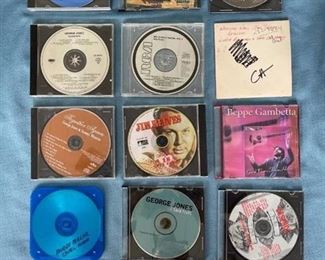 Fifteen country CDs featuring Roger Miller, George Jones, Dolly, Jim Reeves, Patsy, and more