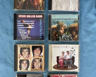 Eight pop and classic rock CDs featuring Raitt, Eagles, Steve Miller, Bay City Rollers, and Mellencamp