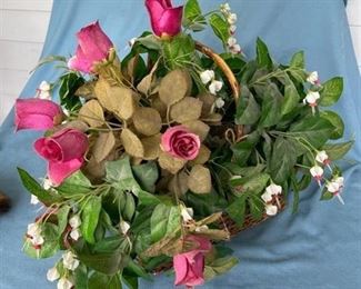 Huge artificial floral arrangement in basket