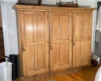 COUNTRY PINE TRIPLE CABINET | Armoire with three cabinet doors; h. 69-1/2 x w. 79 x d. 21 in. 