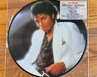MICHAEL JACKSON PICTURE DISC | "The Official Michael Jackson Picture Disc", vinyl LP record, each side with a photo of Michael Jackson, "Includes the hits: 'Billie Jean' / 'Beat It' / 'The Girl Is Mine' / 'Wanna Be Startin' Somethin'' / 'Human Nature'" 