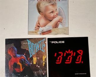 (3pc) ROCK VINYL | Vinyl record albums including 1984 (MCMLXXXIV) by Van Halen, Lets Dance by David Bowie (opened but with original shrink plastic), and Ghost in the Machine by The Police [records not inspected for condition] 