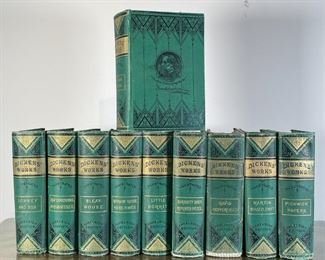 CHARLES DICKENS: EXCELSIOR EDITION | The Excelsior Edition of Charles Dickens' Works, pub. New York: The American News Company, in green tooled binding, with Jas. A. Storer, Bookseller & Stationer bookplates; some or all volumes inscribed, "W. D. Johnson / Present by school in spring of 1882" 