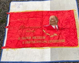 USSR SILK FLAG | Soviet Union era red silk flag with applied / printed decoration with state emblem on one side and the face of Lenin on the other, with text [decoration faded in some areas]; 42 x 69 in.