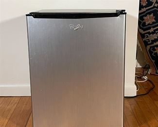 WHIRLPOOL MINI FRIDGE | Compact refrigerator with a black case and a stainless steel door, it works! Model no. WH27S1E; h. 25 x w. 19 x d. 20 in. 