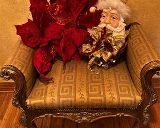 Upholstered bench; large poinsettias; Santa