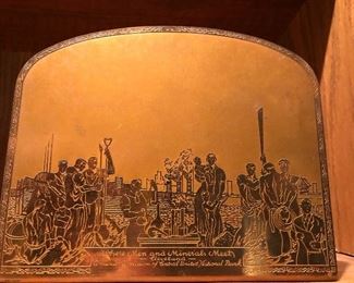 Engraved metal plate bookend depicting a mural Where Men and Minerals Meet, by Ivor Johns at the Central United National Bank, Cleveland