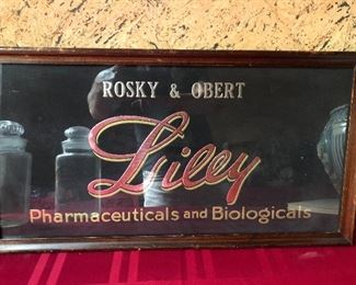 Original glass and foil Liley advertising sign 
