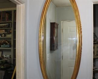Large elongated oval mid century gilt mirror