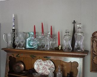 Lots and lots and lots of lovely glass including Early American Pattern Glass, mid century Blenko glass, Elegant Glass, and graduated sizes of blown glass pinch style decanters