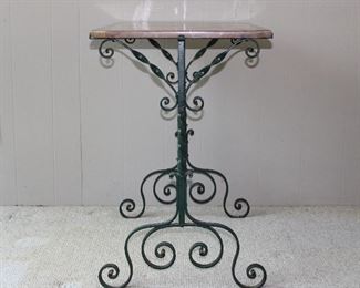 A work of art!  Gorgeous antique c. 1920's pink marble topped hand wrought iron table 30" wide, 20" deep, and 30" tall.  Note the rounded edge on the marble top (and the canted corners!) in superb antique condition!