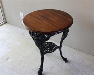 Antique English Pub Table, cast iron base with figural female busts and claw feet.