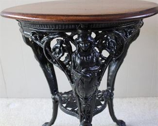 Antique English Pub Table, cast iron base with figural female busts and claw feet.
