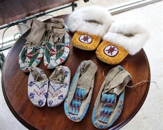 Three old and one contemporary pairs of Native American beaded moccasins -- there is a large collection of Native American pottery, jewelry, bead work, etc.  Please look for more photos to be added over the coming weeks!