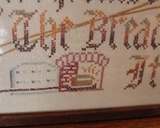 Detail of Cross Stitch Don't praise the bread before it's baked, framed