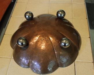 Underside of Arts and Crafts hand hammered copper large bowl on silverplated ball feet, unsigned