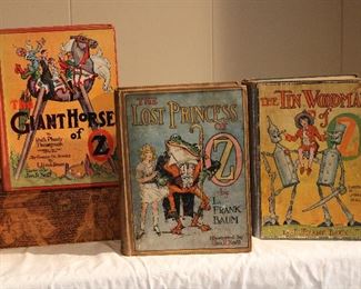 Close ups of THE GIANT HORSE of OZ, THE LOST PRINCESS OF OZ, and THE TIN WOODMAN of OZ, early edition children's books.