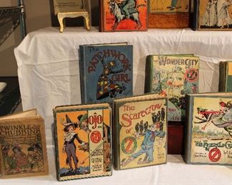 Close ups of OJO IN OZ, The SCARECROW of OZ, The EMERALD CITY of OZ, The PATCHWORK GIRL of OZ, and The WONDERFUL CITY OF OZ,  early edition children's books.