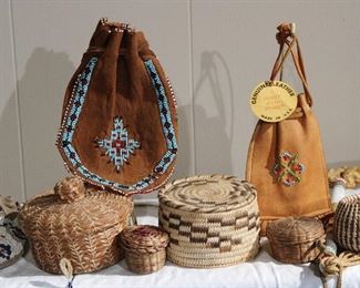 Close up of pine needle baskets, old beaded leather marble bags, Pima Indian basket, etc.