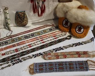 Lovely beadwork pieces - note the antique Lakota Sioux beaded hide bag at the back, and the Sioux knife sheath