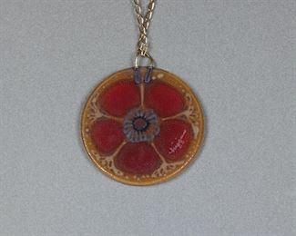 Signature on back of fantabulous large 1960's or early 1970's signed Higgins Glass round flower power pendant!
