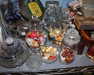 Hundreds of old dice and dominos and marbles and buttons and game pieces, mostly being sold in apothecary jars and other containers
