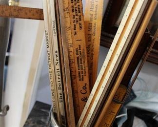 Antique advertising yard sticks, some with Muskegon advertising