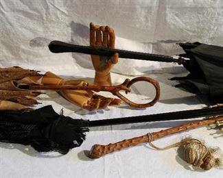 Old parasols in need of some TLC and articulated wood hands!
