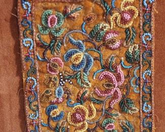 Detail of antique Persian or Moghul India beaded miniature rug, framed