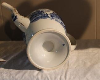 Underside of antique blue and white coffee pot