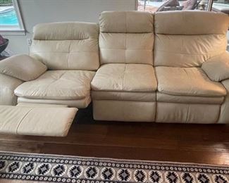 24)   $525   Cream "Stone" Power leather sofa 3 seats, 2 recliners on each end, center seat stationary.   • 40high 95wide 39dee