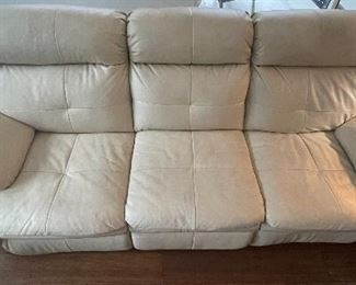 24)   $525   Cream "Stone" Power leather sofa 3 seats, 2 recliners on each end, center seat stationary.   • 40high 95wide 39dee