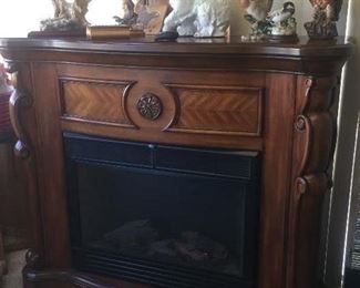 Hang your stockings on this beautiful free standing fireplace / heater with remote.