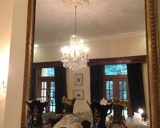 Fine French Trumeau Mirror and notice the fine french porcelain clock and the matched pair of Old Paris Vases.  The back sides feature Marie Antoinette and her mother,  Empress Maria Theresa