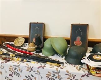 We have a WW 1 British bayonet, a very early African hand woven basket, a Native American  pine straw basket, WW 1 -WW 2 helmets and a big old stack of 45 records including the Beatles and several 1960's bands