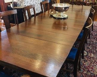 an antique 11' 4" dining table 10 chairs.  The table can be adjusted to make a smaller 6' table