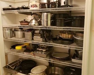 Pantry with many pots and pans, vintage toasters