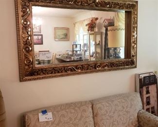 Low back love seat and heavy gold gilt mirror