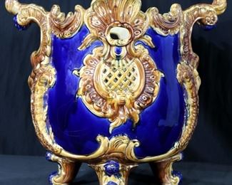 25 - Majolica hand painted jardiniere with feet, cobalt blue and gold, signed England, 15 in. T, 17 in. W, 14 in. D.